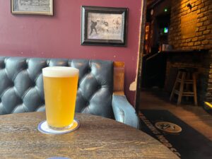 A pint of Whiplash Rollover on a table at The Bleeding Horse