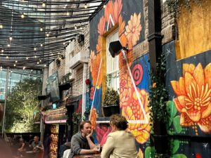 The back room at Dockers Bar - overhanging lights and murals