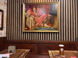 A picture on the wall and tables inside The Morris Bar.