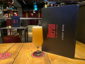 A beer and menu at Tapped